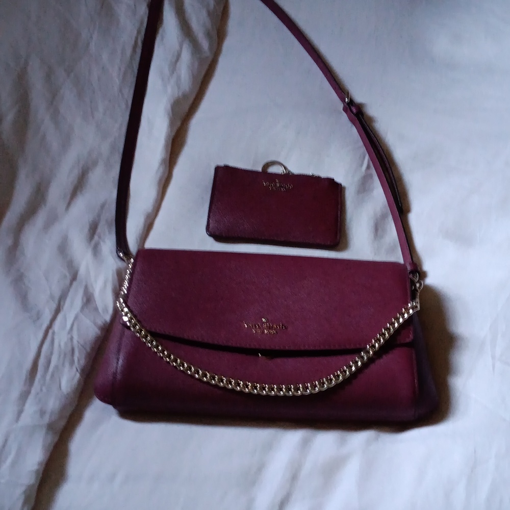Kate spade deep red/maroon bag with wallet. Excellent condition is barely used.